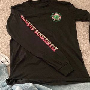 Small, black christmas long sleeve by Simply southern with festive back design.